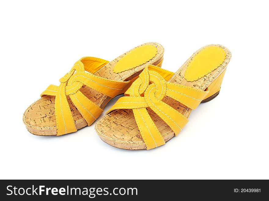 Yellow shoes on white background.