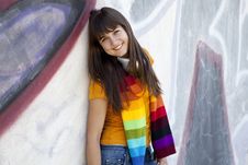 Teen Girl With Earphones Near Graffiti Wall. Stock Images Teen Girl With Earphones Near Graffiti Wall. Stock Images