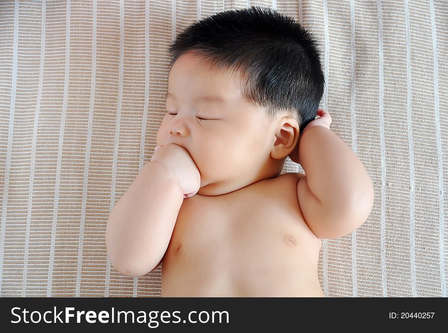 A 2 months chinese Baby girl lying on the bed. A 2 months chinese Baby girl lying on the bed