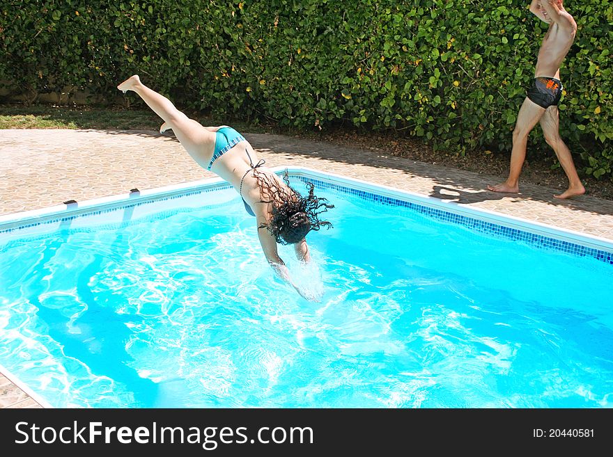 Pretty women jumping to swimming pool. Pretty women jumping to swimming pool.