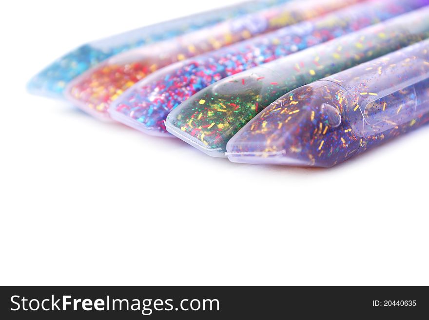 Colorful glitter glue  on white background.