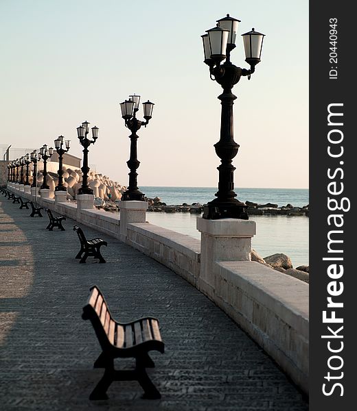 Embankment in Italy with a street lamp in the foreground