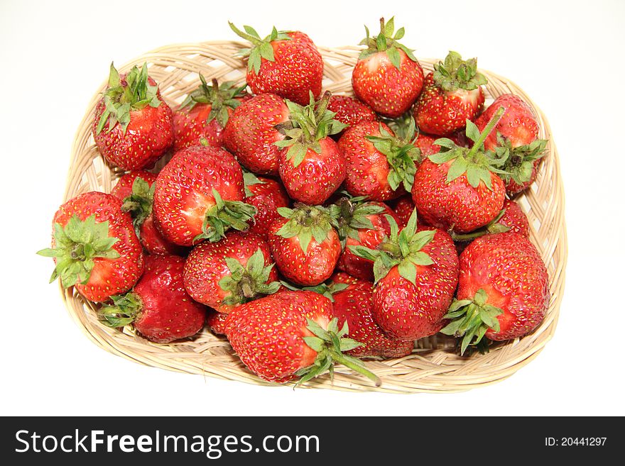 Much fresh strawberry with leaves in a basket. Much fresh strawberry with leaves in a basket