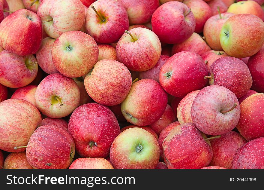 Fresh red apples with drops of water