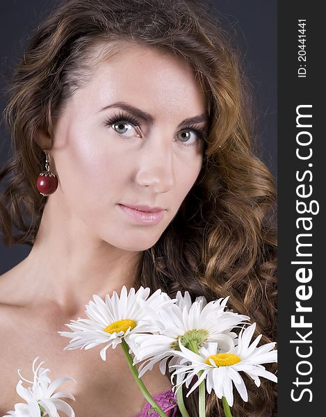 Beautiful Young Woman With Camomile