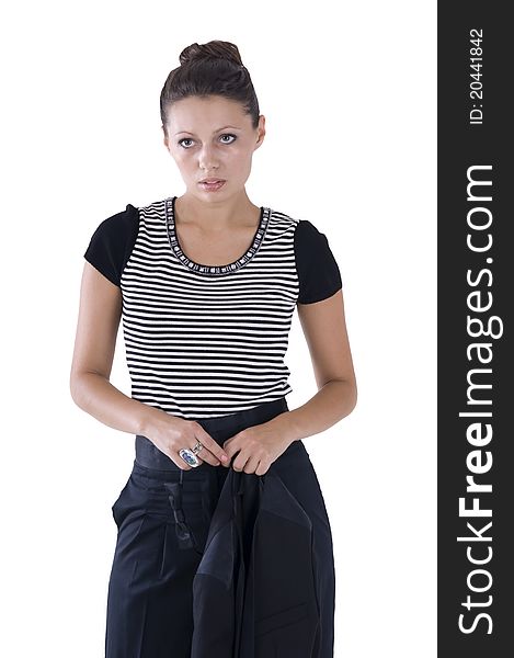 Portrait of a beautiful girl in black trousers on a white background. In the hands of keeps jacket. Portrait of a beautiful girl in black trousers on a white background. In the hands of keeps jacket.