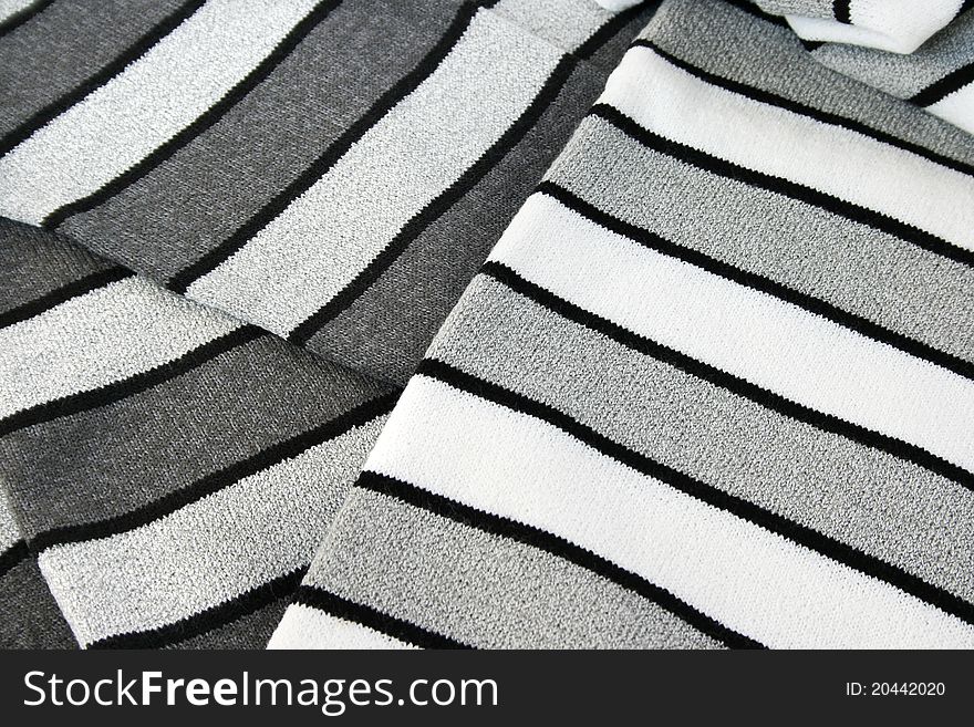 Black, gray and white knitwaer as a background. Black, gray and white knitwaer as a background.