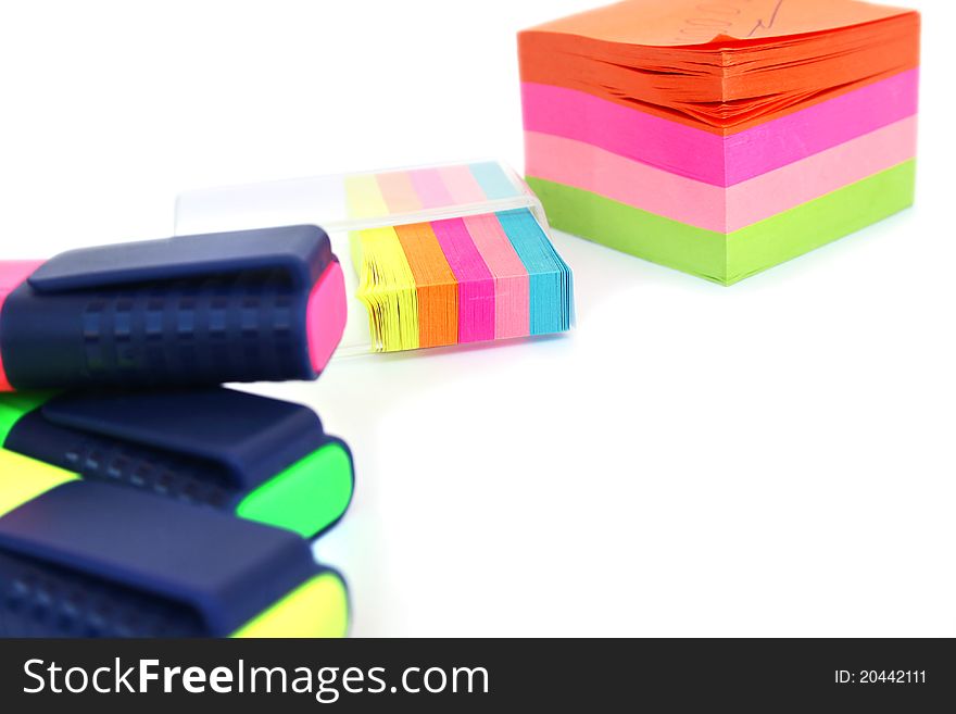 Colorful papers and markers on white background. Colorful papers and markers on white background.