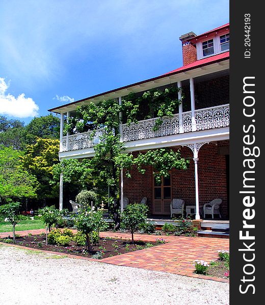 Grand building surrounded by sunny garden. Grand building surrounded by sunny garden.