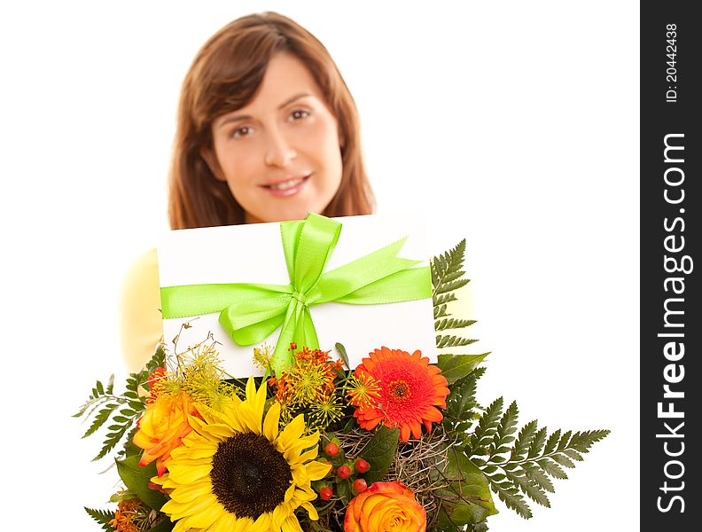 Beautiful woman holding coupon on flowers