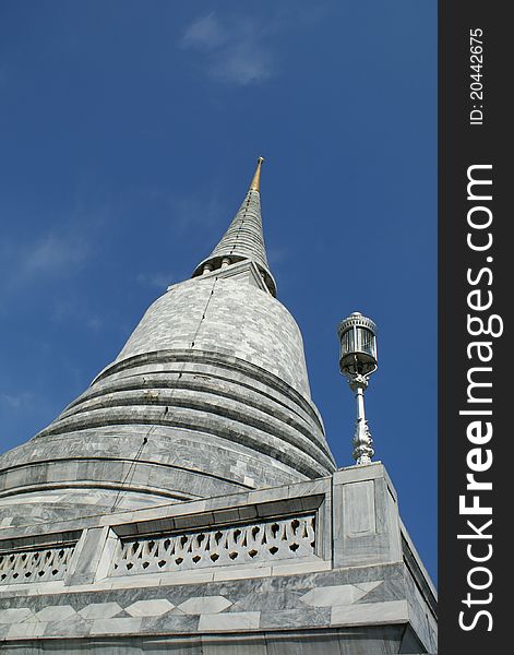 White stone pagoda in a Buddhist temple in Bangkok