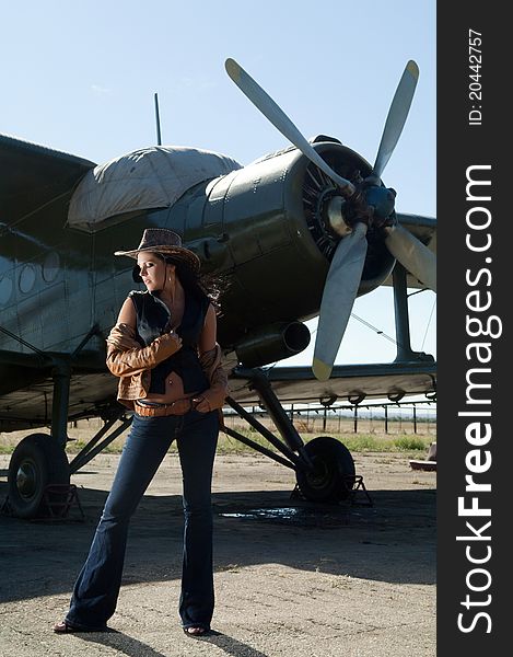 Woman In Jeans And Aircraft