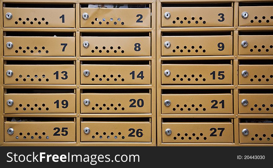 Many metal mailboxes with blank name tags