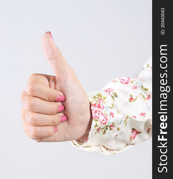 Portrait of attractive hand young woman showing a thumbs up. Portrait of attractive hand young woman showing a thumbs up