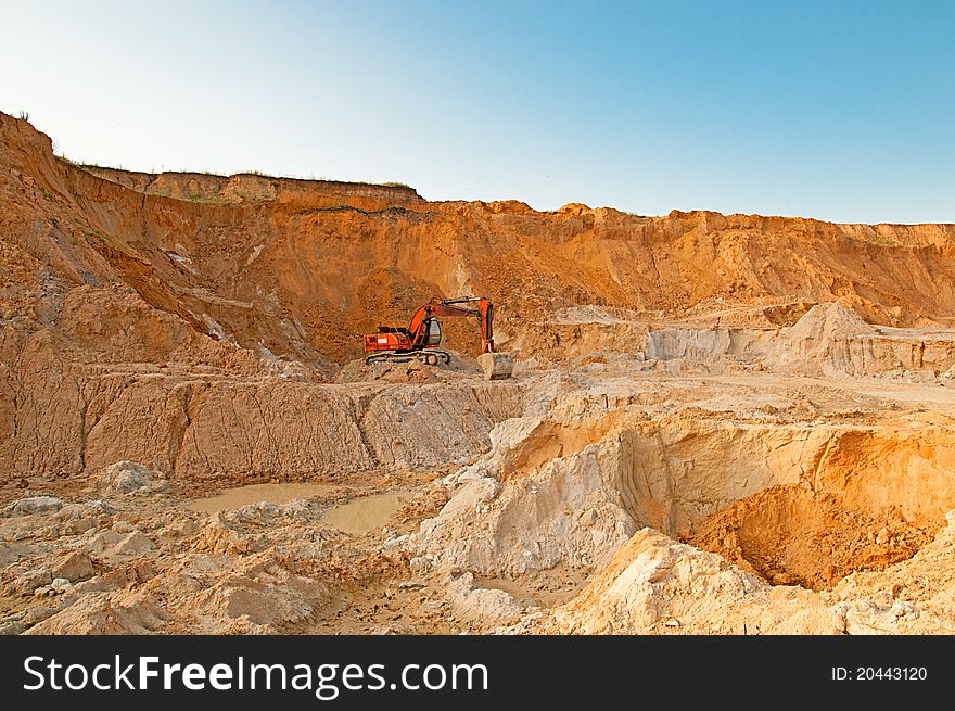 Excavator in the sand quarry