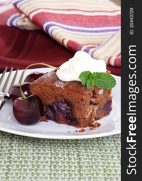 Cake baked with dark and white chocolate filled with fresh summer cherries. Cake baked with dark and white chocolate filled with fresh summer cherries