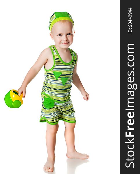 Little boy with a watering can on a white background