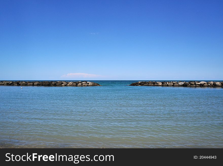 Rocks with outlet to the sea freely with water and sky. Rocks with outlet to the sea freely with water and sky