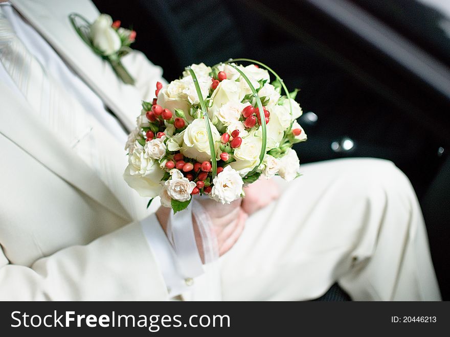 Groom holding beautiful wedding bouquet. Groom holding beautiful wedding bouquet