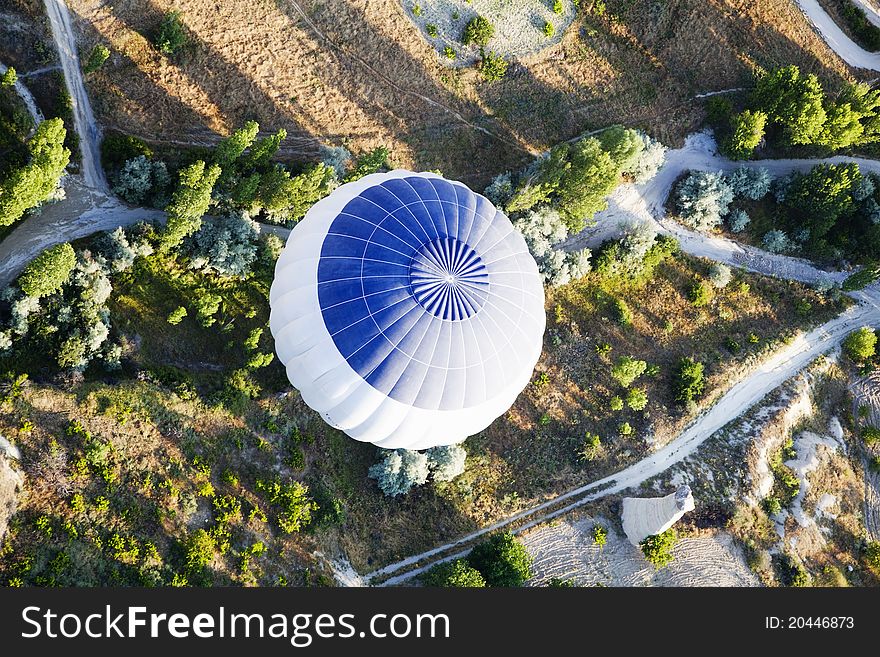 From above blue white hot air balloon