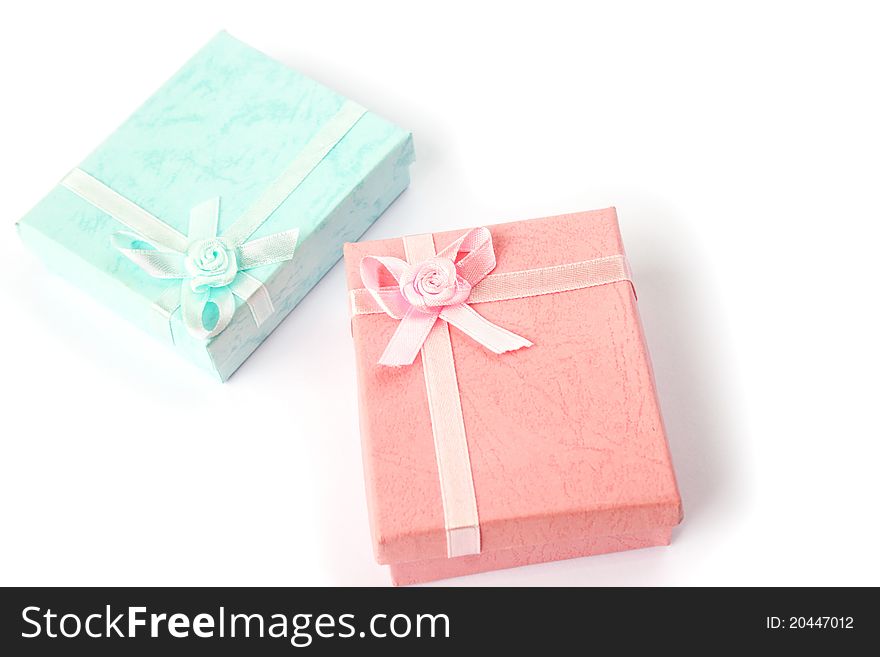 Pink and blue gift boxes  on white background.