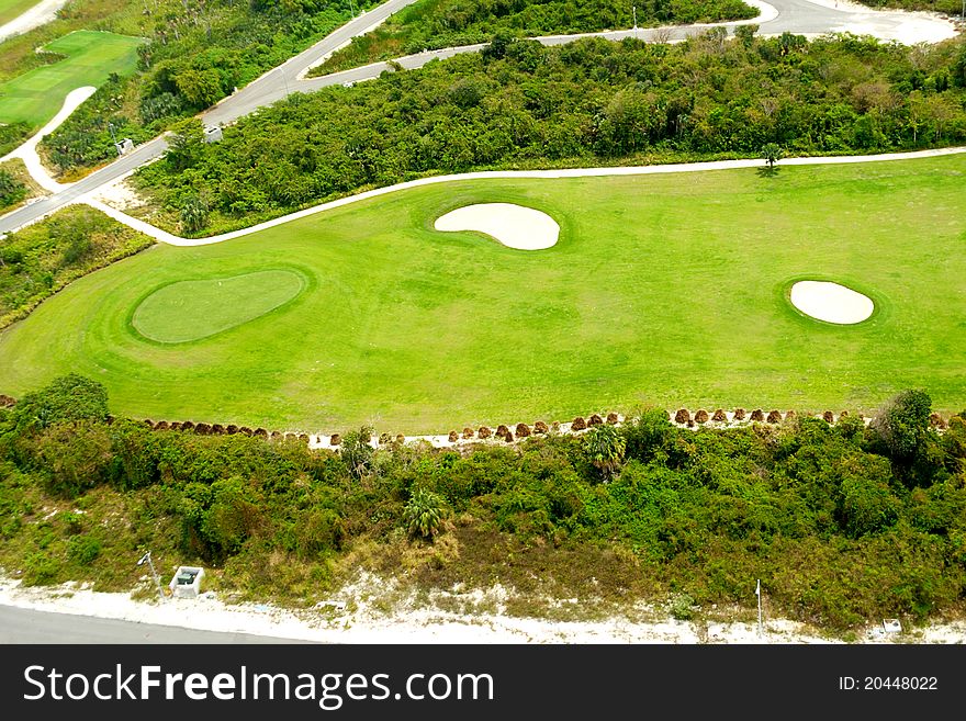 Flying above a golf course at an exotic destination. Flying above a golf course at an exotic destination