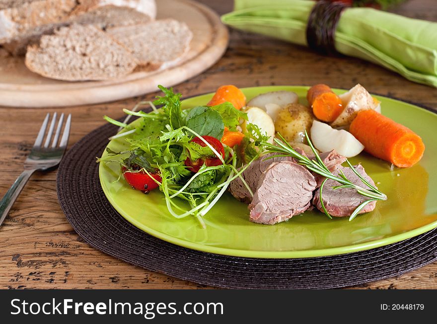 Pork tenderloin with potato and salad