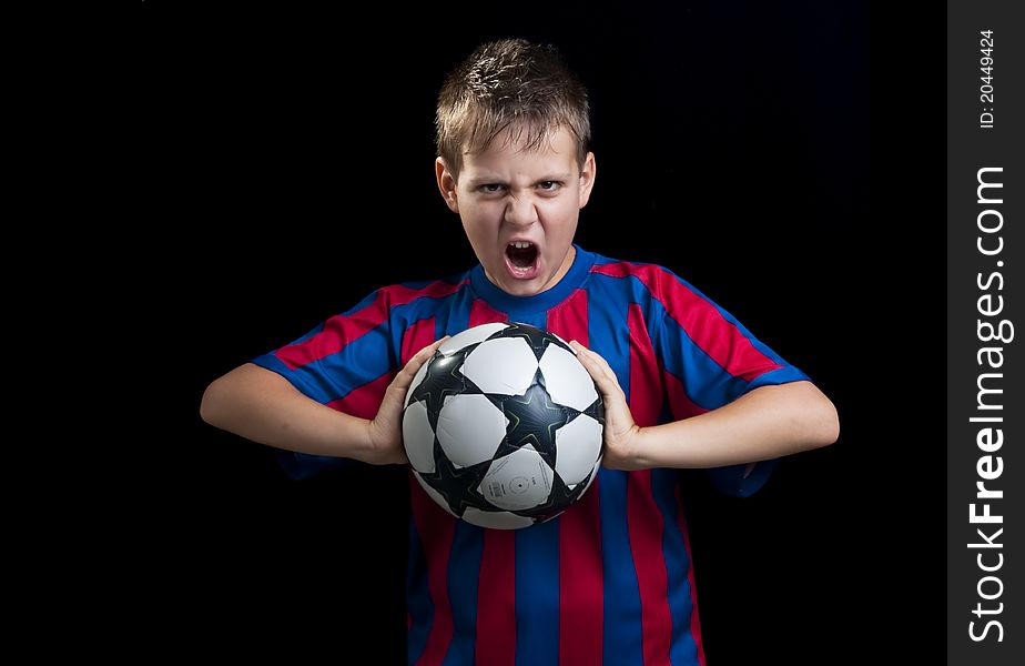 Boy crying with ball on black background. Boy crying with ball on black background