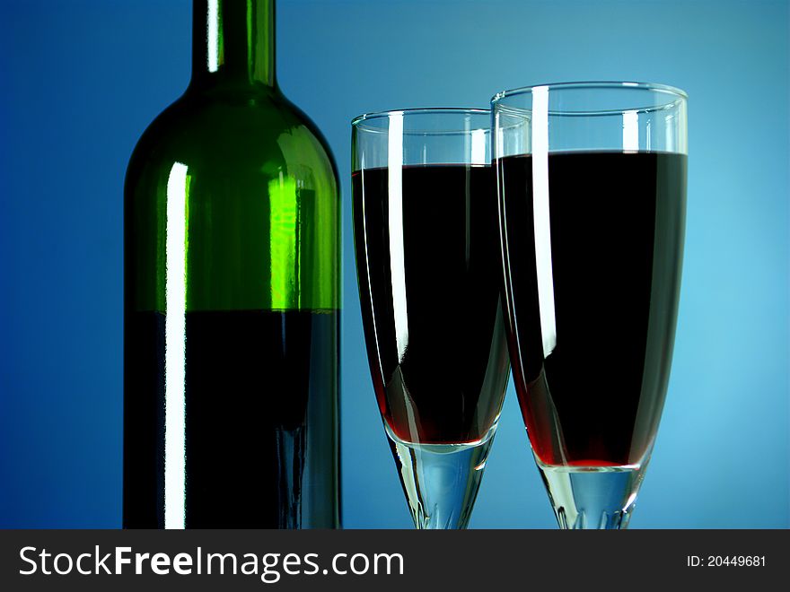Bottle of wine and two glasses filled with wine. Bottle of wine and two glasses filled with wine