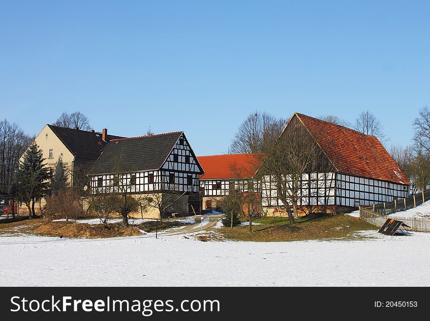 Traditional farm house in winter