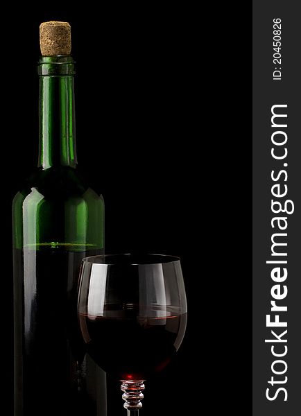 Glass of red wine isolated on black