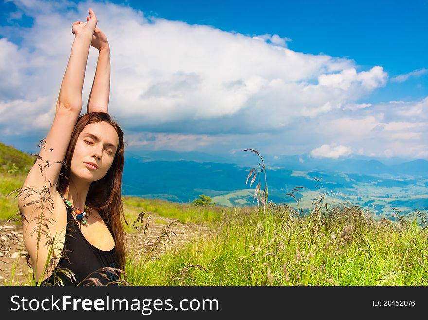 Beautiful young woman under blue sky. Portrait