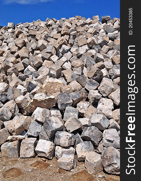 Granite cobble-stones on road building. Granite cobble-stones on road building.