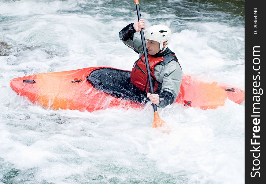 An active kayaker on the rough water