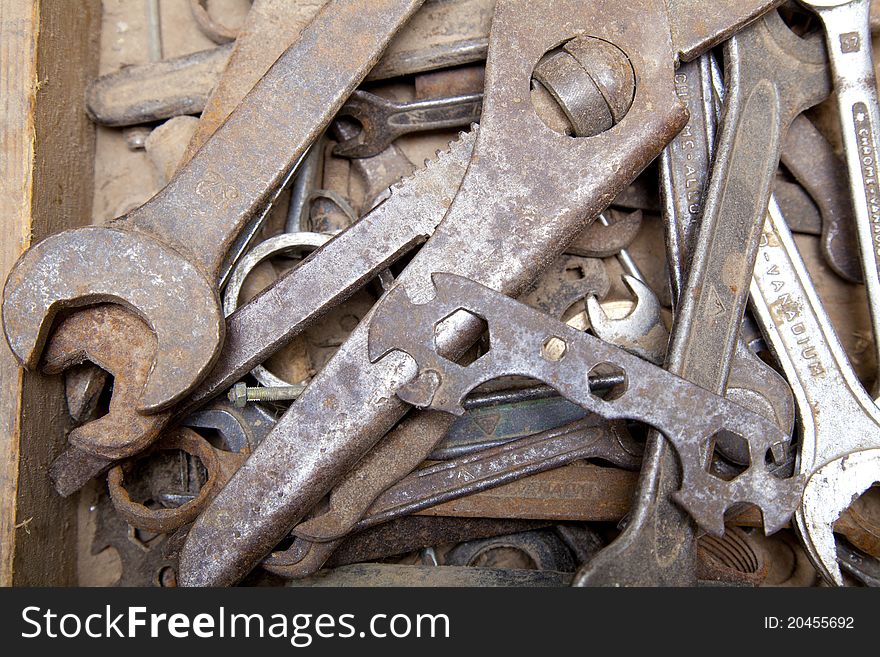 Old iron tools in wooden box. Old iron tools in wooden box