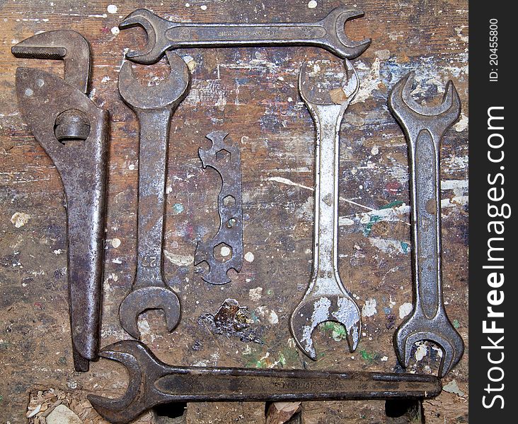 Old isolated rusty tools on wooden background. Old isolated rusty tools on wooden background