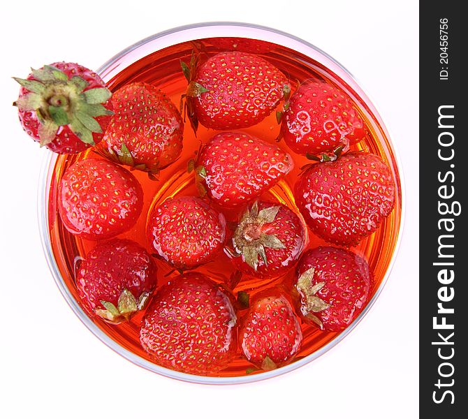 Jelly with strawberries in a glass cup. Jelly with strawberries in a glass cup