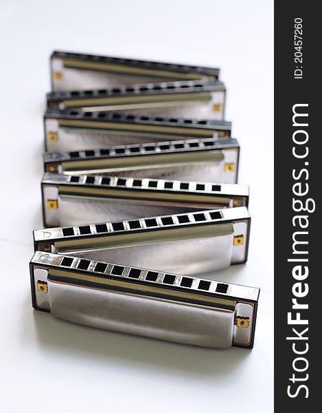 Seven piece of harmonica set arranging in zigzag. Seven piece of harmonica set arranging in zigzag