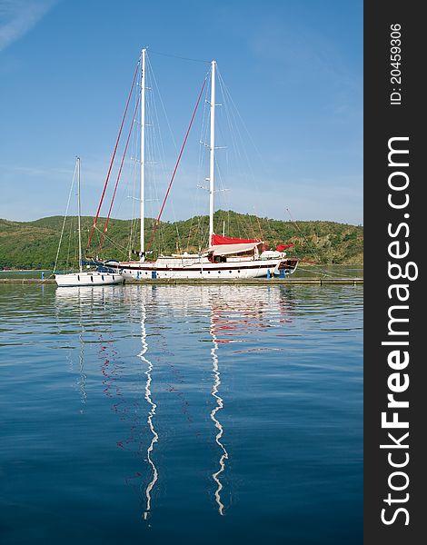 Yacht and boat in the harbor and reflection