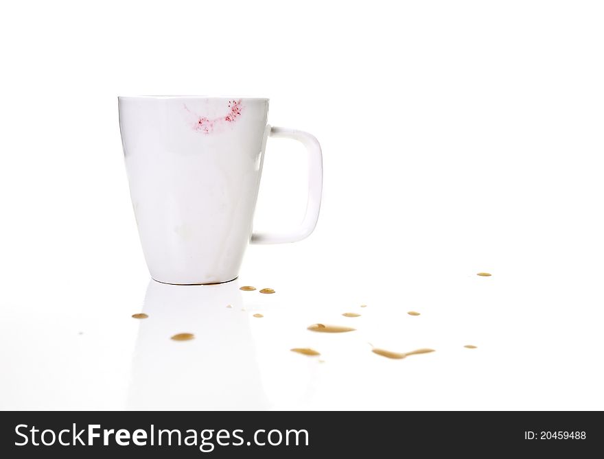 A lipstick mug surrounded with coffee splatters... Isolated!. A lipstick mug surrounded with coffee splatters... Isolated!
