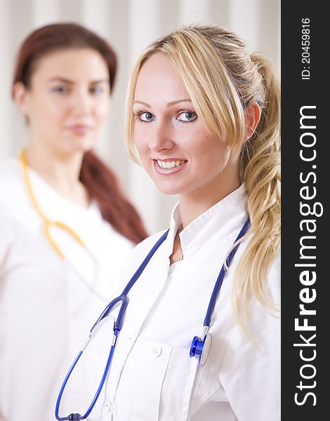 Portrait of two smiling doctors in uniform. Portrait of two smiling doctors in uniform