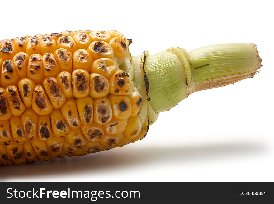 Grilled vegetables: corn. Visible part of the cob. Isolated on a white background. Grilled vegetables: corn. Visible part of the cob. Isolated on a white background.