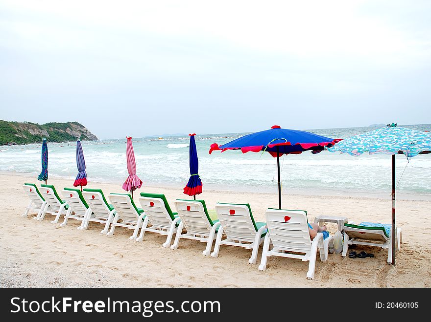 Sun beach chairs and the sea