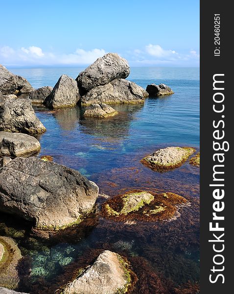 Giant stones in the sea with clouds