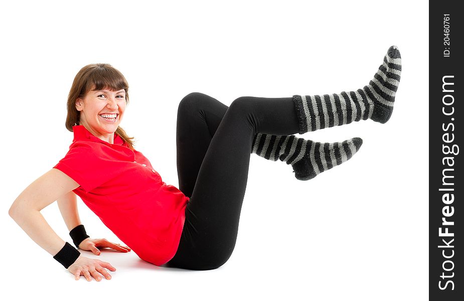 Happy young woman makes fitness exercises isolated over white background. Happy young woman makes fitness exercises isolated over white background