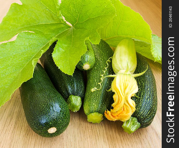 Marrows with grean leaves on the table