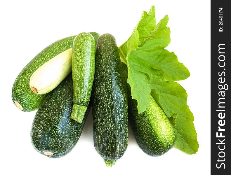 Marrows with grean leaves on a white background