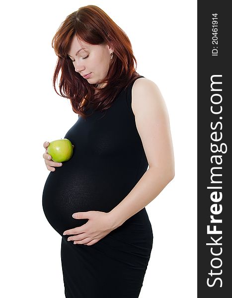 The pregnant woman with an apple isolated on white