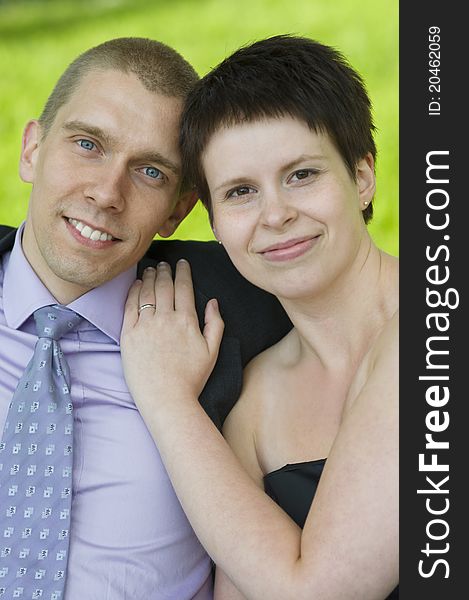 Portrait of couple on a park bench. Portrait of couple on a park bench