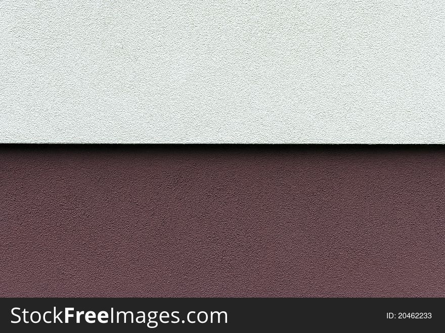 White and maroon wall of the house